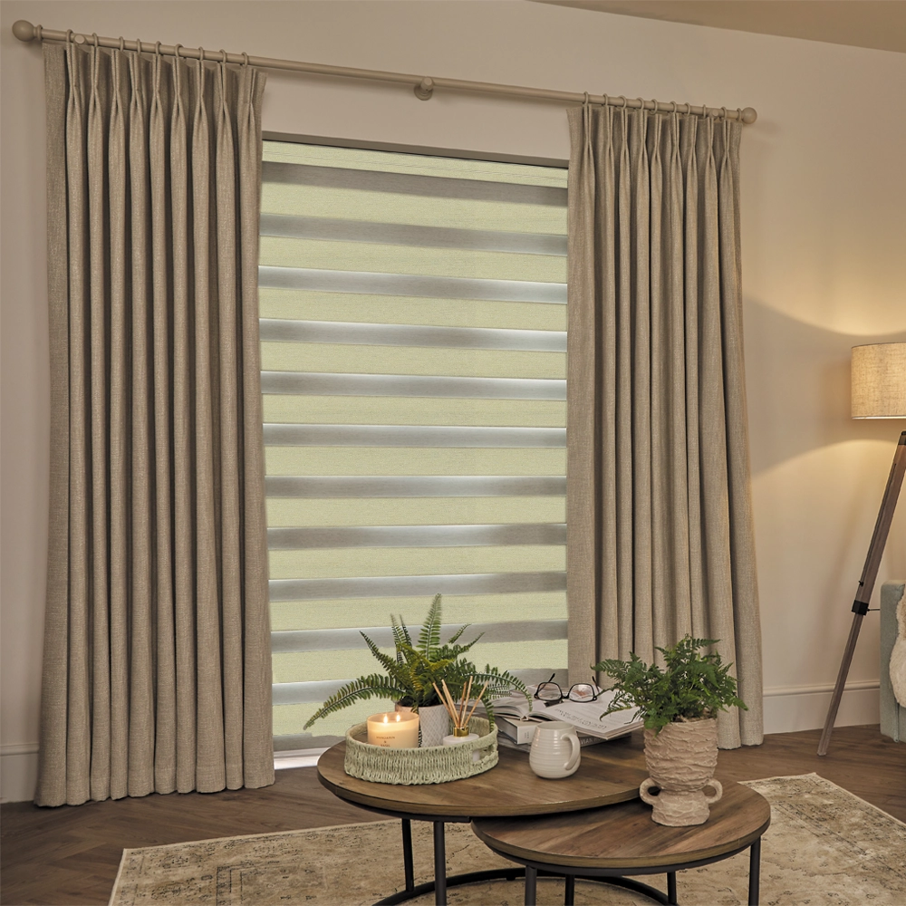 Made to measure Lustre Champagne Blackout Day and Night Blinds with alternating blackout and sheer fabric panels.