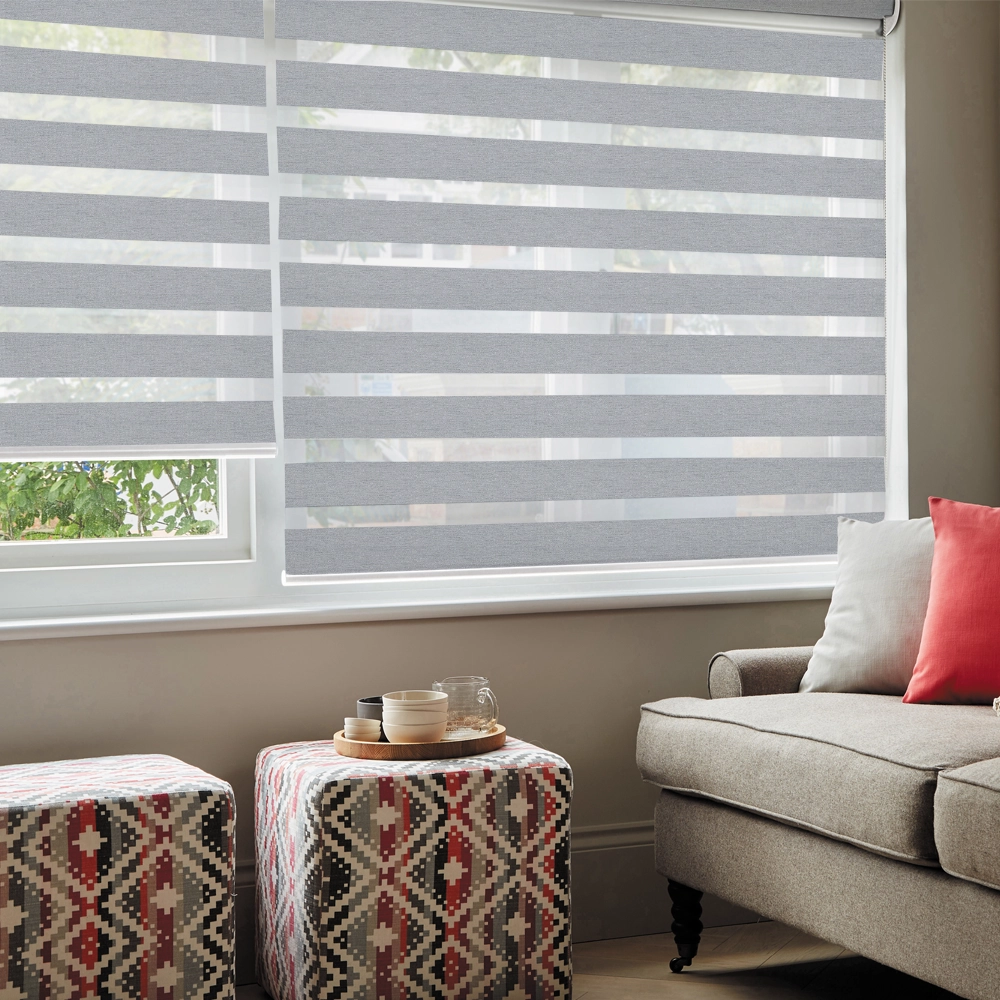 Lustre Silver Blackout Day and Night Blinds in a modern bedroom with enhanced privacy and room darkening.