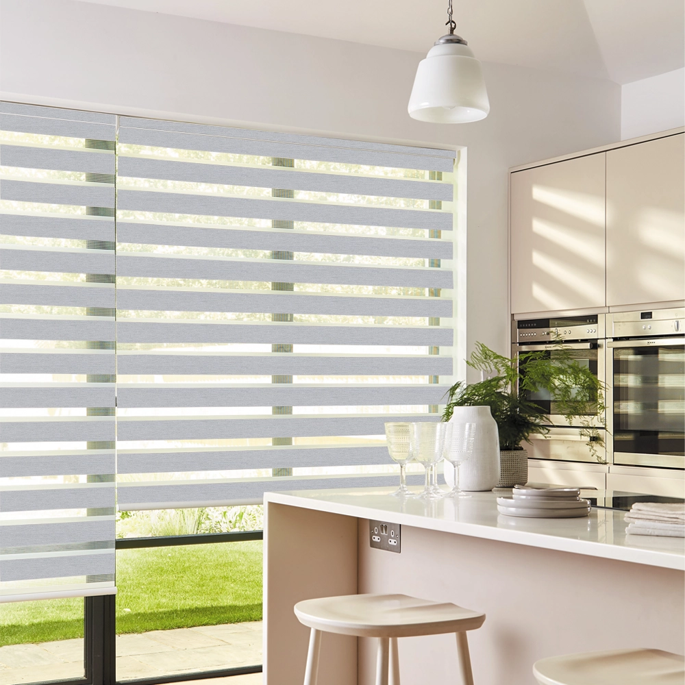 Lustre Silver Blackout Day and Night Roller Blinds providing room darkening and privacy for modern homes.