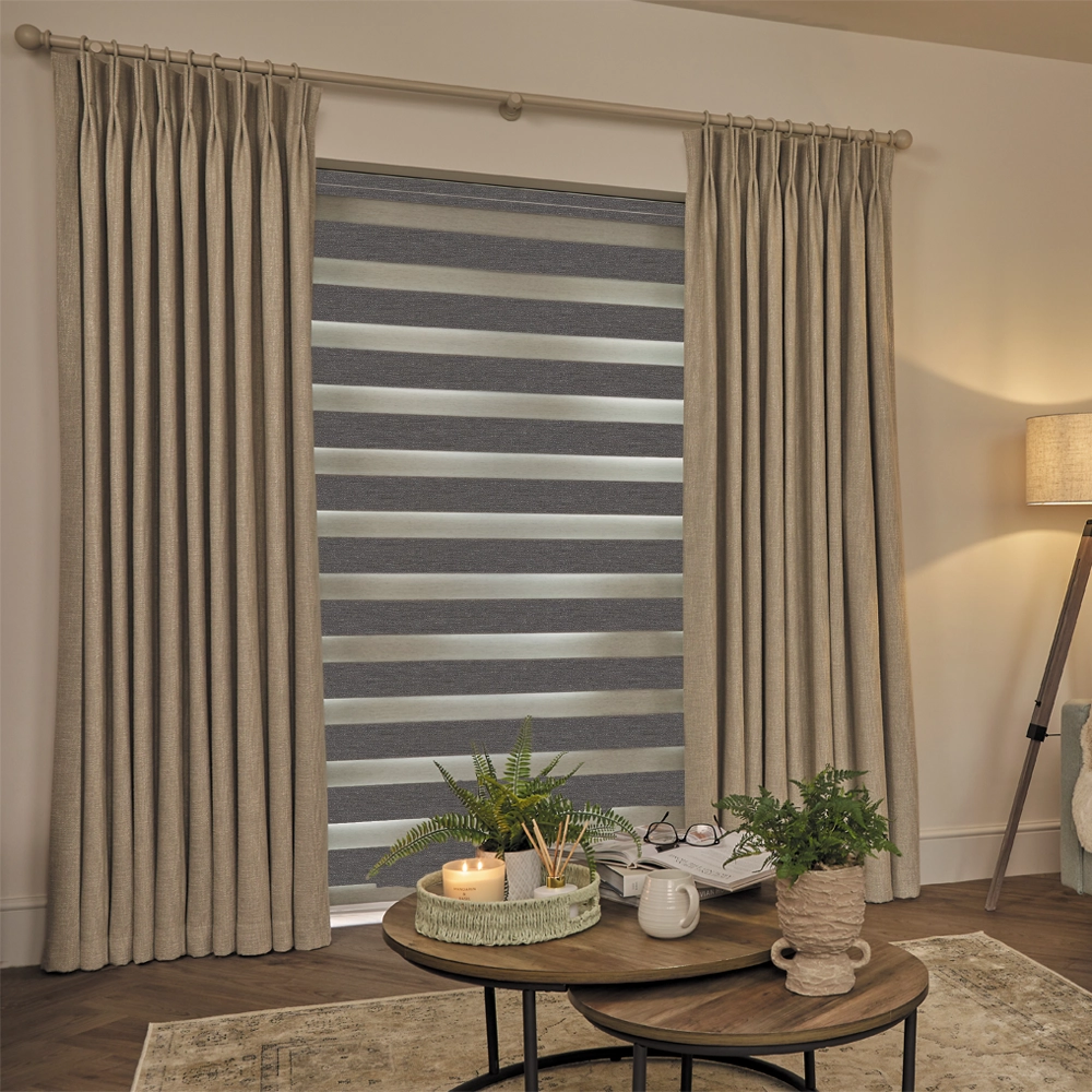 Made to measure Lustre Zinc Blackout Day and Night Blinds with alternating blackout and sheer fabric panels.